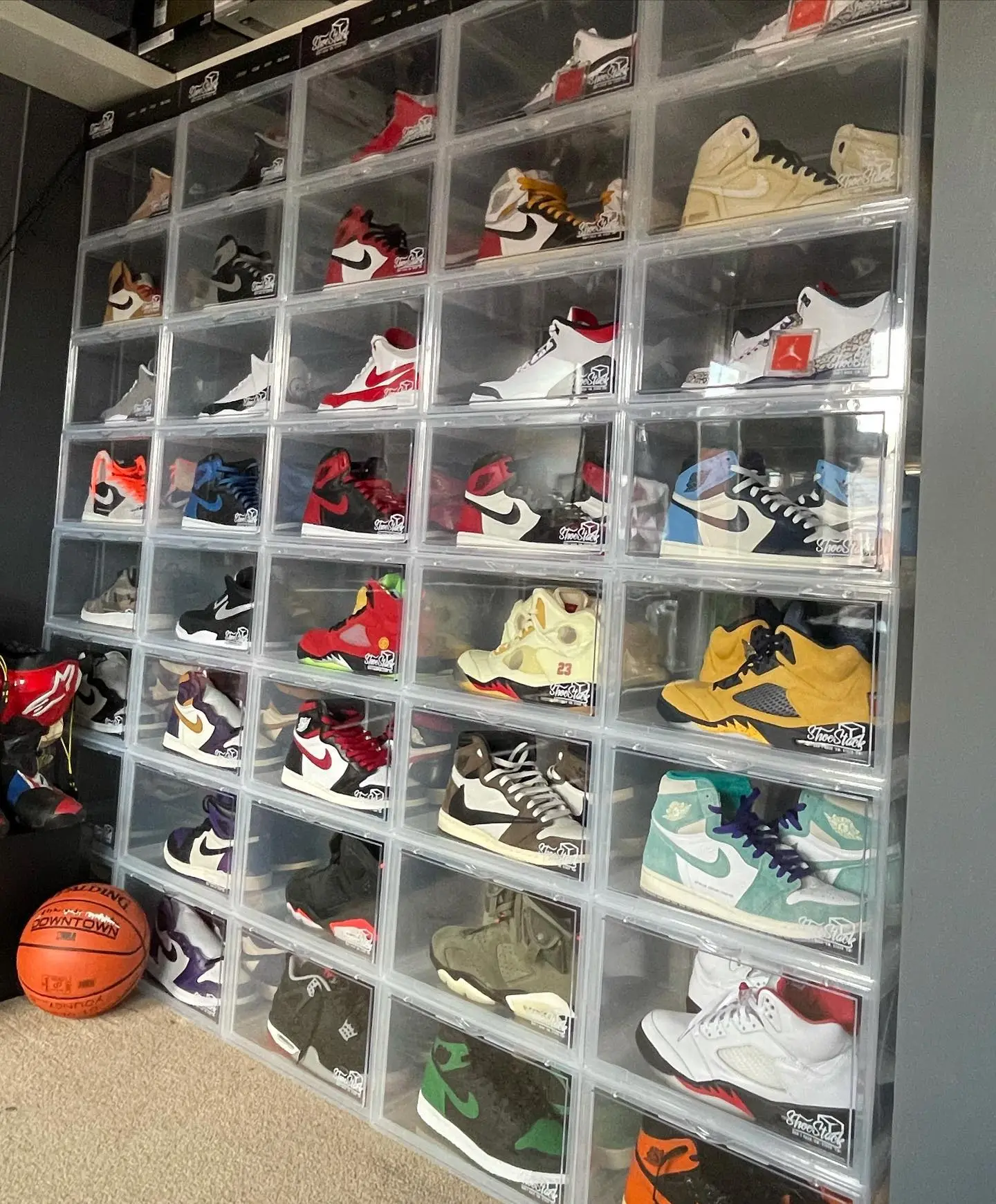 clear side view shoe boxes dream wall of shoes stacked up